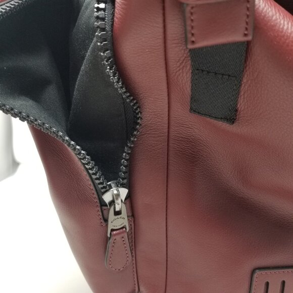 COACH Men's Burgundy Red & Black Leather Metal Buckle Drawstring Laptop Backpack - Picture 6 of 16
